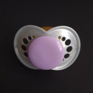 Clear PRU pacifier shield with a purple button.